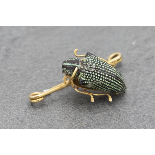 95 - 18ct petrified Scarab Beetle brooch, 4.5cm long, 4g