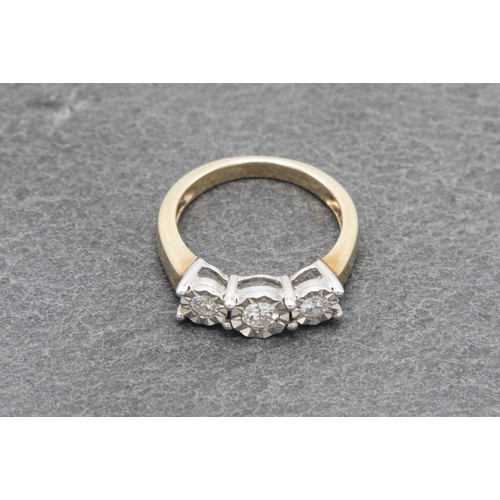 102 - 9ct diamond three stone cluster ring, the central stone 0.15ct, size J, 2.6g