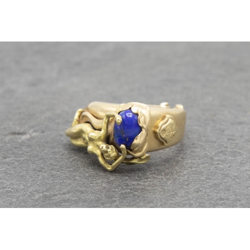 103 - Good quality 18ct Lapis Lazuli figural ring, with reclined nude, size N, 9.7g