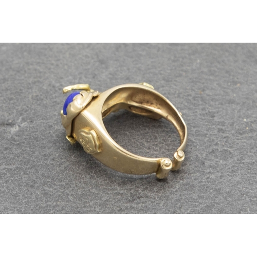 103 - Good quality 18ct Lapis Lazuli figural ring, with reclined nude, size N, 9.7g