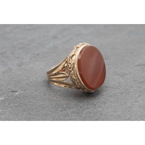 104 - 9ct large carnelian signet ring, size R/S, 12.9g