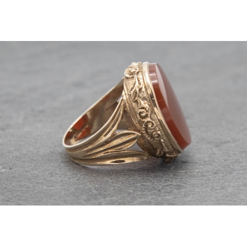 104 - 9ct large carnelian signet ring, size R/S, 12.9g