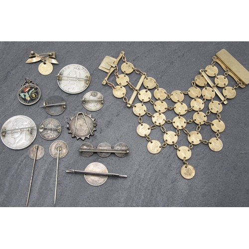 107 - A collection of silver and other coin brooches and other jewellery (13)