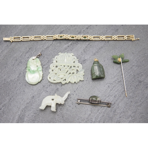 108 - A collection of seven jade jewellery pieces, to include two pendants, bracelet, brooch, stickpin and... 