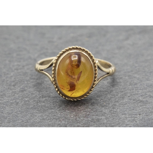 115 - 1920s 9ct and Baltic amber dress ring, size K, 1.6g