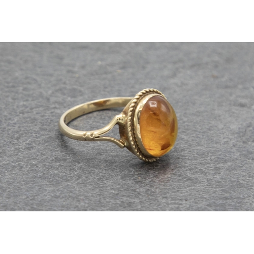 115 - 1920s 9ct and Baltic amber dress ring, size K, 1.6g