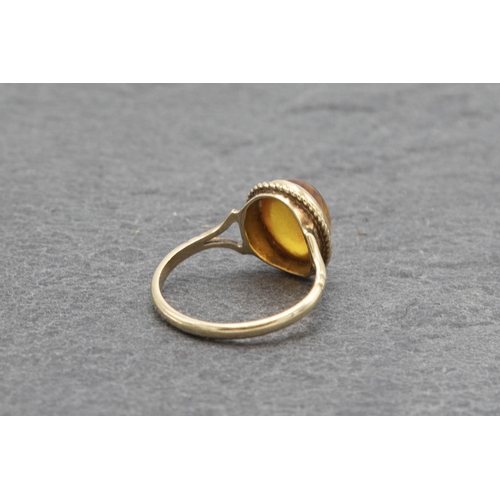 115 - 1920s 9ct and Baltic amber dress ring, size K, 1.6g