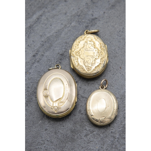 126 - Three Victorian 9k front and back locket pendants, the largest 3.4 x 2.7cm (3)