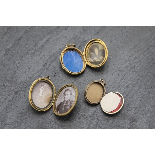 126 - Three Victorian 9k front and back locket pendants, the largest 3.4 x 2.7cm (3)