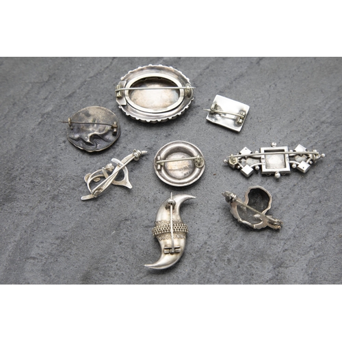 133 - Eight Victorian silver brooches, 38.7g