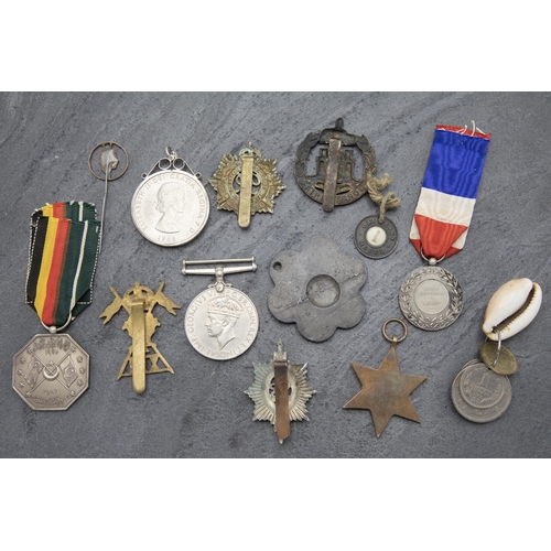 145 - Collection of Military medals and related items, to include 1947 Pakistan medal 1939-1945 medal and ... 