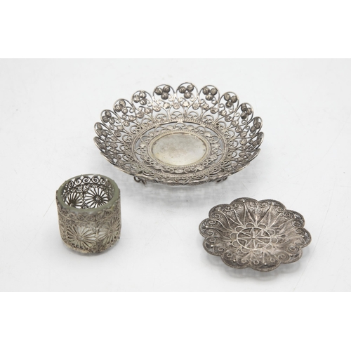 196 - Two filigree silver dishes, the largest 13cm diameter with further salt, 4.5oz approx