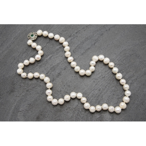 153 - Single strand of freshwater pearls retailed by Lane Crawford of Hong Kong, 58cm long