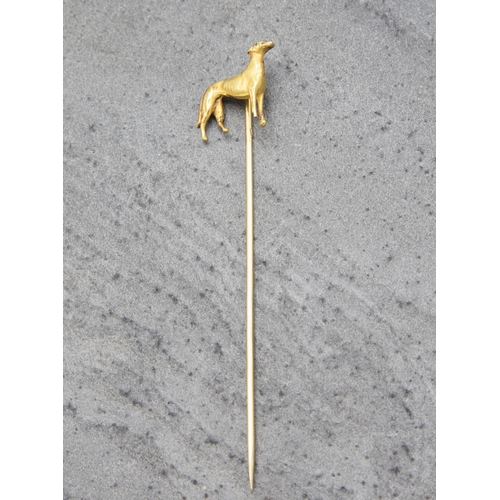 155 - Good 18ct stick pin mounted by a standing Lurcher, 8cm, 3.5g