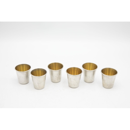 207 - Set of six Russian silver Vodka tots with engraved decoration and gilt interiors, 4cm high, 3.5oz ap... 