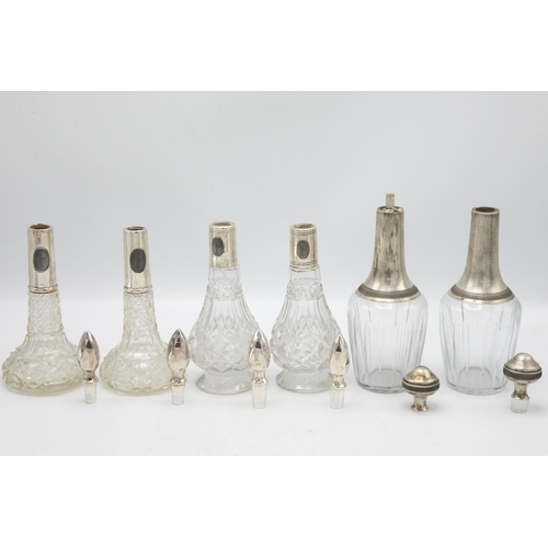 216 - Three pairs of continental silver applied decanters or small scent bottles, the largest 20cm high (6... 