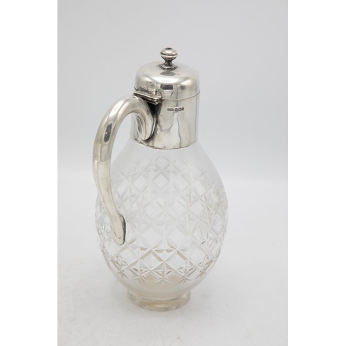 244 - Edwardian silver and glass claret jug in the manner of Christopher Dresser, maker James Dixon & Sons... 