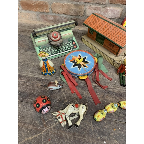 3642 - Assortment of vintage tin plate toys to include typewriters, instruments and Hornby train platform (... 