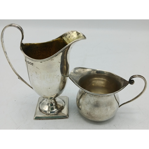 121 - Georgian style Edwardian helmet cream jug, maker HS, London 1901, 12cm high, with a further silver c... 