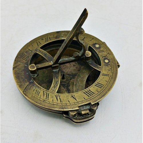 219 - Charles Schmalcalder of 82 Strand London, brass pocket sundial and compass, 7cm diameter