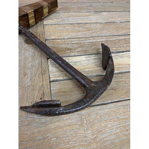 2216 - Cast iron maritime ships anchor with oak and brass panelled finish, H 55cm x W 47cm