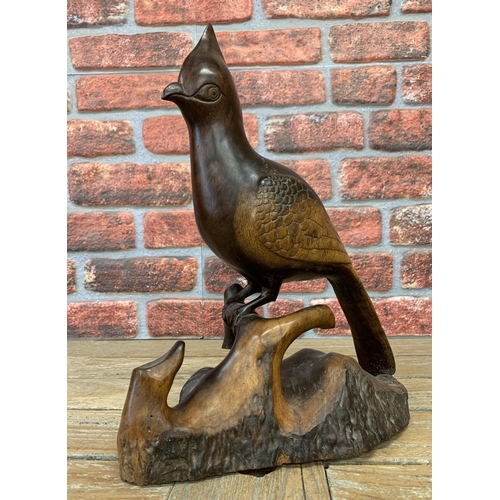 2177 - Carved exotic wood bird, inscribed 'Damiano KWC 07', 40cm high