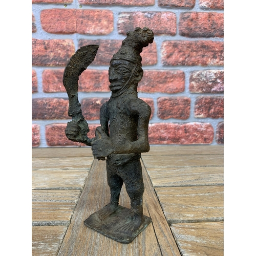 2099 - Tribal interest - Benin bronze figure of a standing tribesman holding a sword, 23cm high