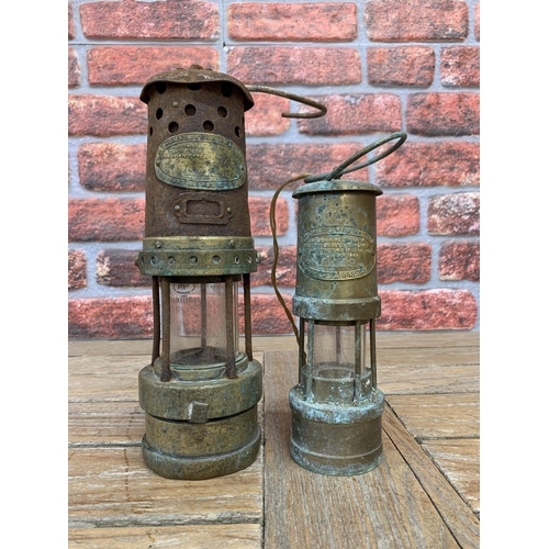 2227 - Two vintage brass and tin Welsh miners lamps by Thomas and Williams Ltd, 27cm and 20cm respectively ... 