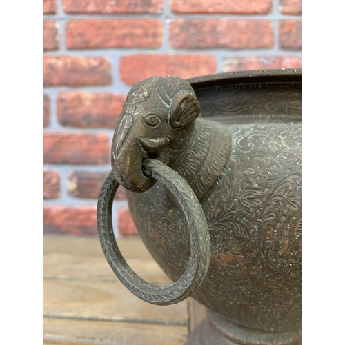 2228 - Antique Persian twin handled pedestal pot engraved with a hunting scene with twin elephant head ring... 