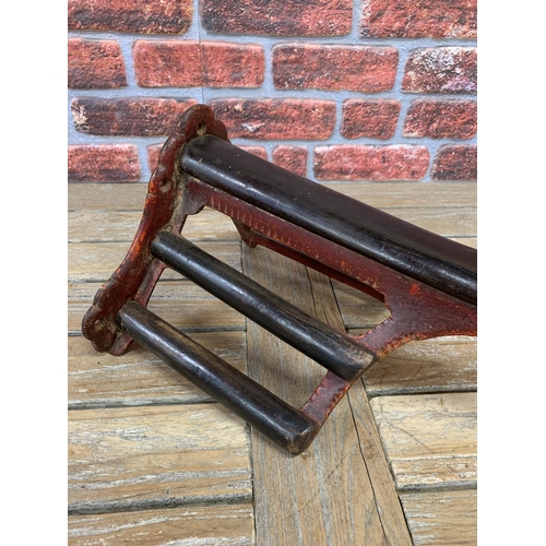 362 - Good quality 19th century cast iron and mahogany saddle rack, with red gesso painted finish, 47cm de... 