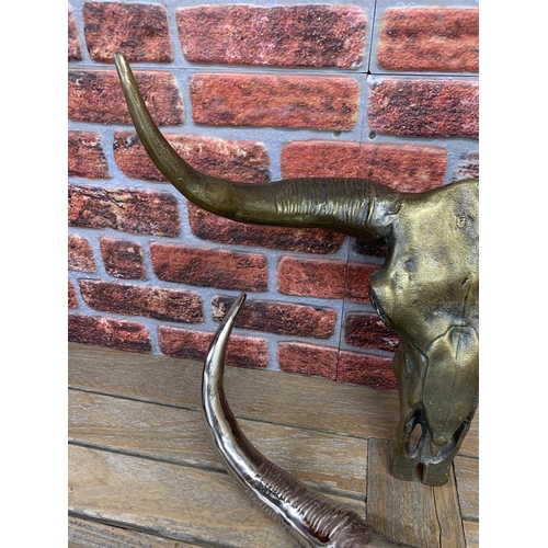 2242 - Large Aluminium Cow Bull Bison Skull Wall Hanging, one with polished finish and one with Bronze fini... 