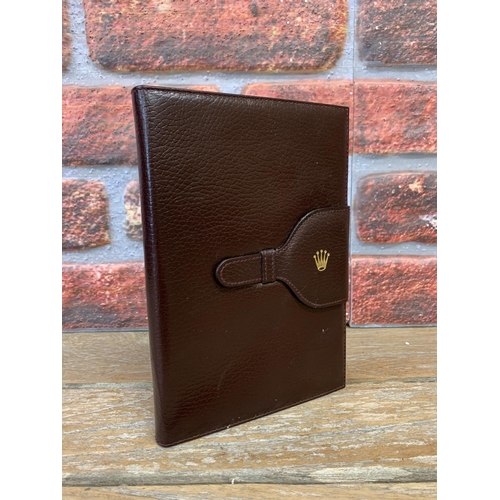 2299 - Vintage brown leather Rolex note pad, marked to the exterior with the Rolex crown, with each of the ... 