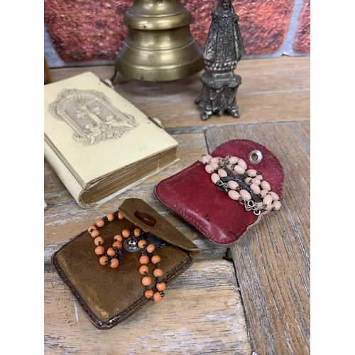 224 - Assortment of religious Christianity collectables to include bone covered bibles, pray beads, brass ... 