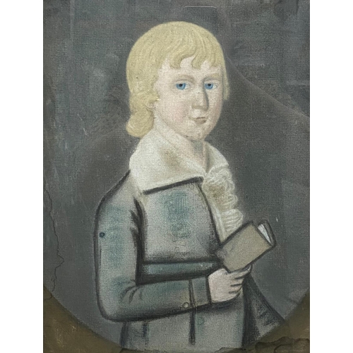 503 - 19th century American school - Folk Art half length portrait of a boy and a book, pastel, 35 x 27cm,... 