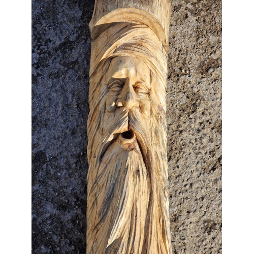 1269 - A carved wooden log sculpture of a bearded man, H 153cm