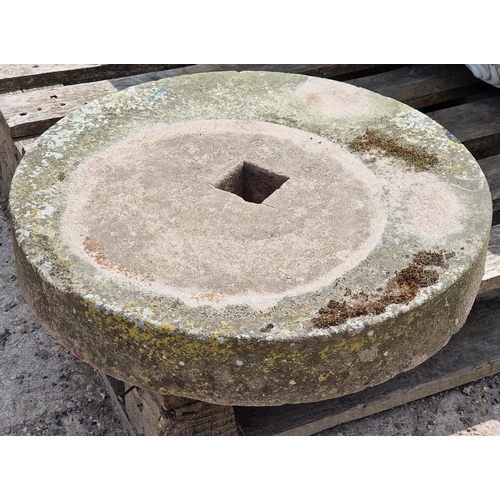 1268 - A weathered natural stone grinding wheel / mill stone, H 8cm x W 46cm