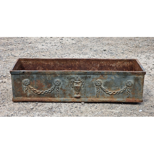 1013 - 19th Century cast iron window box, embossed with urns and swags, 60cm long