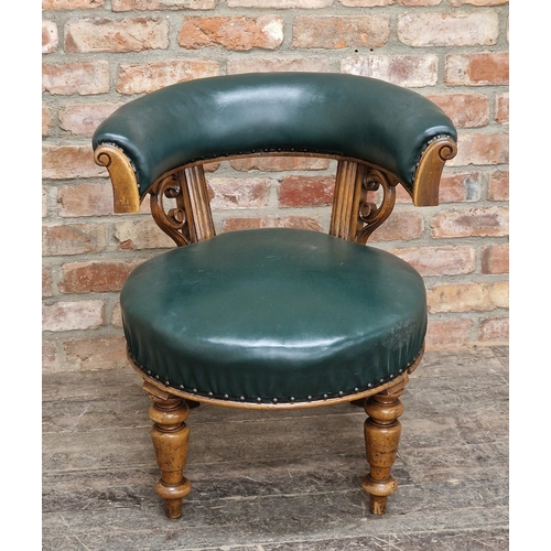 1337 - 19th century horseshoe shaped office chair with leather upholstery and carved detail raised turned f... 