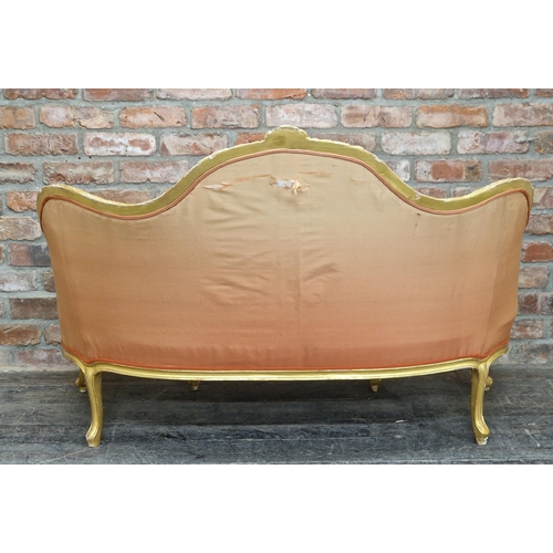 1338 - Antique French gilt wood sofa with coral button back upholstery and foliate decoration, raised on ca... 