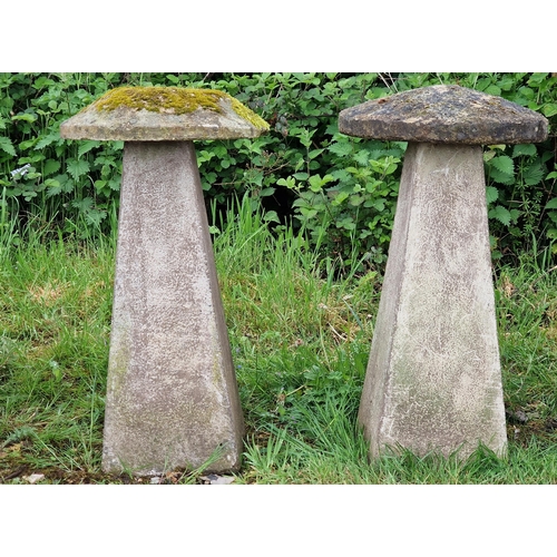 1040 - A pair of weathered reconstituted stone staddle stones, H 83cm x 47cm diameter