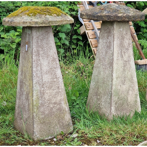 1040 - A pair of weathered reconstituted stone staddle stones, H 83cm x 47cm diameter