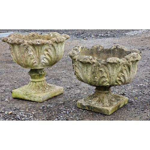 1055 - A matched pair of reconstituted stone garden urns of acanthus leaf design, H 45cm (largest) (2)