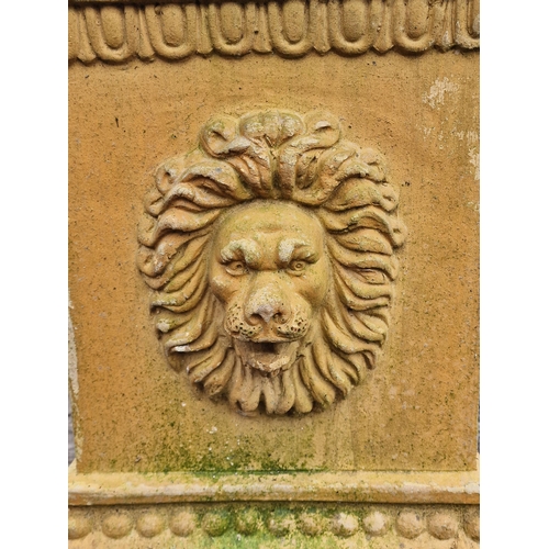 1058 - A good quality weathered terracotta plinth with lions mask decoration, H 55cm x W 42cm x D 42cm