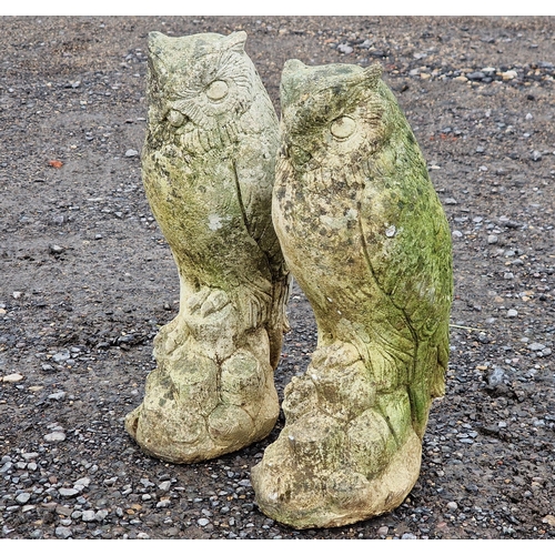 1110 - Two weathered reconstituted stone owl statues, H 38cm (2)