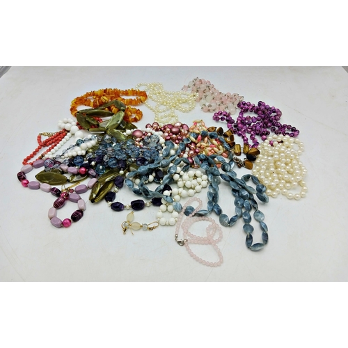 41 - Large collection of bead necklaces to include coral and amber example