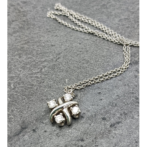 45 - Tiffany & Co platinum and diamond four stone cross pendant, with four stones on Tiffany & Co platinu... 