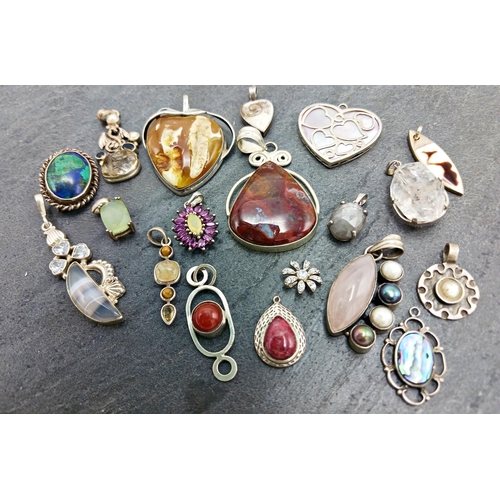66 - Collection of various silver pendants and brooches, 130g