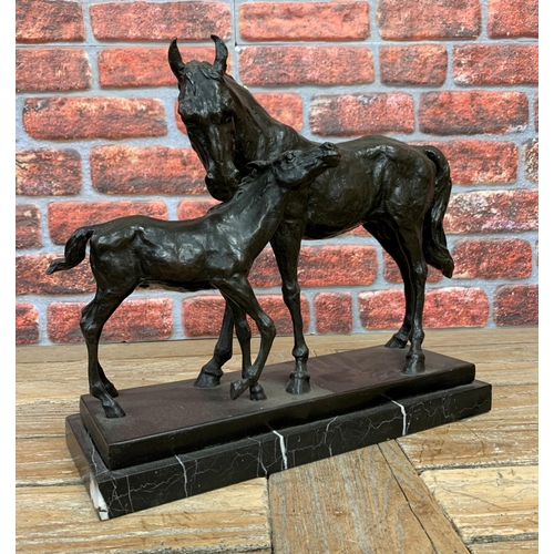 335 - Large bronze figure of horse and foal atop heavy marble base, W 40cm x H 34cm