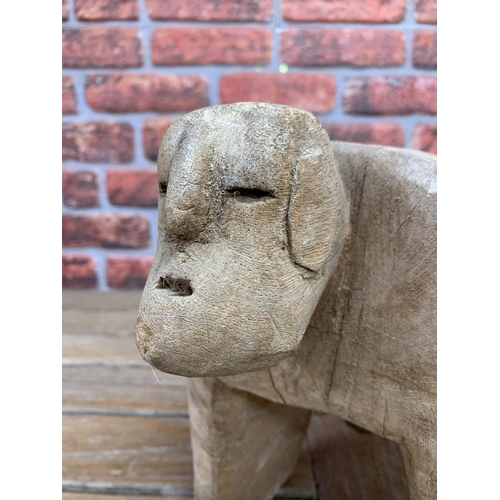 2148 - Folk Art Hand carved wooden decorative figure, on four legs L50cm H28cm (AF)