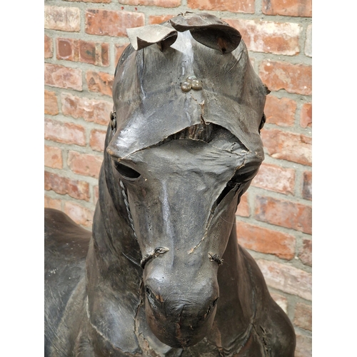 284 - Impressive 19th century French leather horse sculpture on iron trestle base, H 158cm x W 175cm